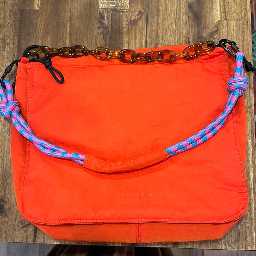 Brand new, never used Rotunda red shoulder bag/ purse with double straps